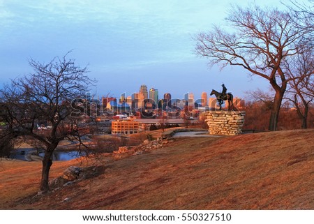 View of Kansas City, Missouri skyline at dusk during golden light from the Kansas City Scout Memorial with all registered trademarks removed.