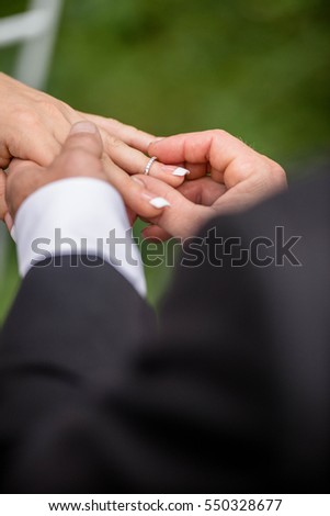Bride And Groom Exchanging Wedding Rings