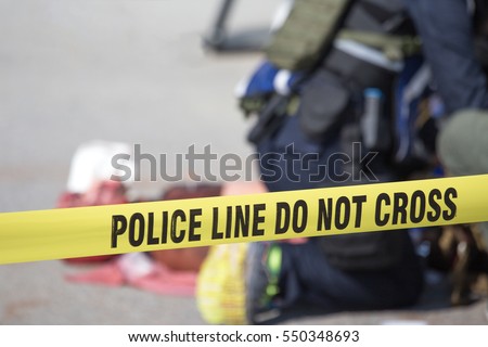 police line do no cross with blurred medic law enforcement  background in medical evacuation training with copy space Royalty-Free Stock Photo #550348693