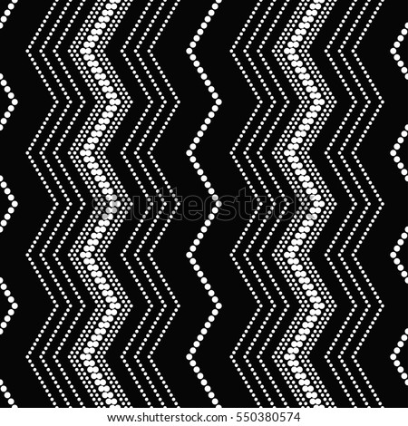 Tiled seamless zigzag pattern. Chevrons. Wavy ornament of dotted lines. Abstract black and white background. Vector Illustration. Royalty-Free Stock Photo #550380574