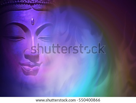 Mystical Buddha Background - ethereal colored gaseous vapours rising up with a partial Buddha head emerging from the darkness on left side and copy space on right