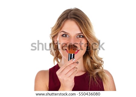 Picture of a beautiful lady powdering her nose