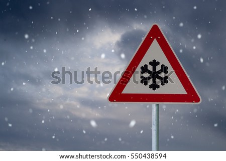 traffic sign winter with dark clouds