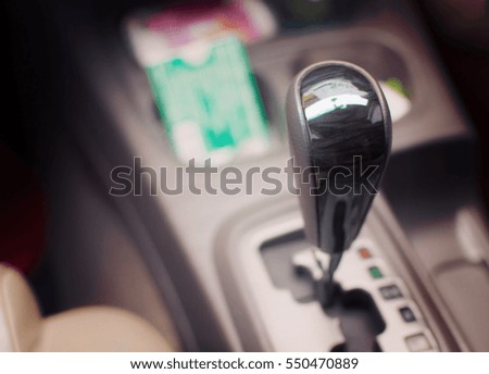 Gear stick on auto transmission car. selective focus.
