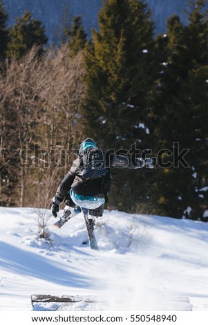 Skier jump from wooden springboard in the mountains