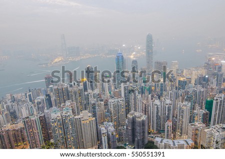 Hong Kong the scenes, victoria harbour from the peak bird view, in the mist with bad weather in the evening, nimbus landscape on the trails