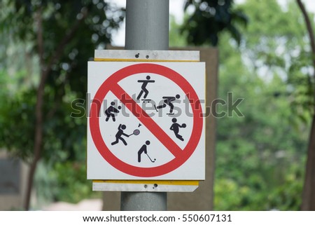 Not allowed to play in this area, there were signs: Do not play volleyball, badminton, golf, skateboarding, roller blades and basketball.