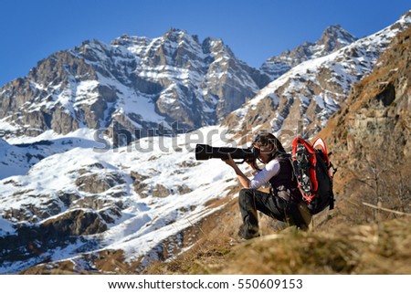 Girl nature photographer. Gran Paradiso National Park, Italian Alps.