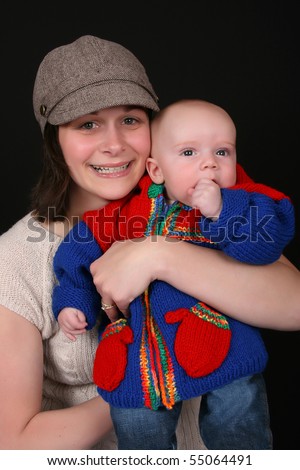 Beautiful mother and baby on a black background