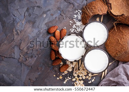 Oat, coconut and almond milk. Non-dairy vegan drink. Selective focus Royalty-Free Stock Photo #550672447