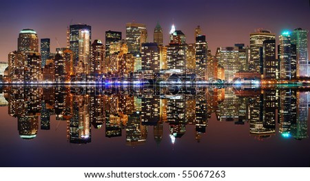 New York City Manhattan panorama skyline at night with reflection
