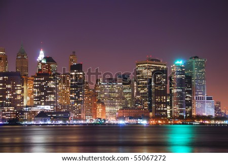New York City Manhattan Skyline night panorama over Hudson River with reflection.