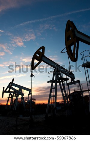 oil pumps on the sunset sky background