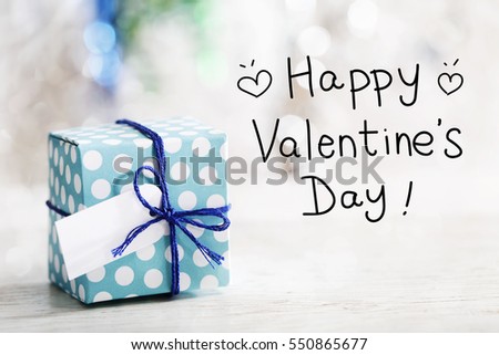 Happy Valentines Day message with small handmade gift box 