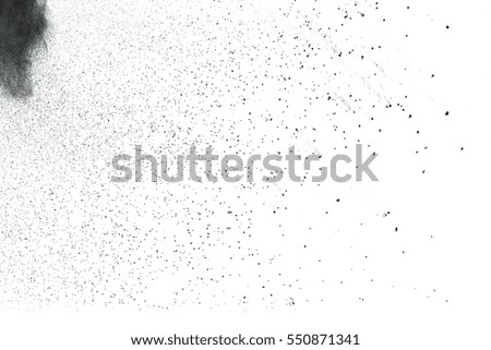 The black powder splattered on white background, Abstract black particle background. Holiday texture.