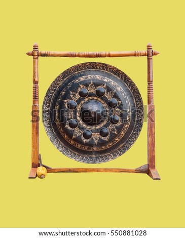 Thai Temple Gong with Wooden Stand Isolated on Yellow Background