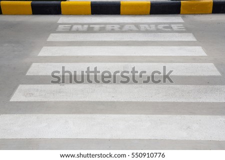 cross road and entrance word on street near footpath