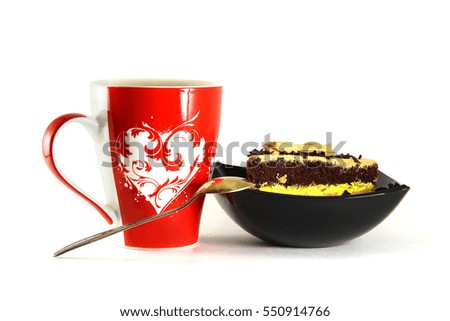 A cup with a picture of the heart, with a sweet dessert. Isolate