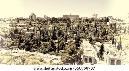 View from top of ancient walls surrounding Old City in Jerusalem. View on the landmarks of Jerusalem Old City. Vintage Style Toned Picture