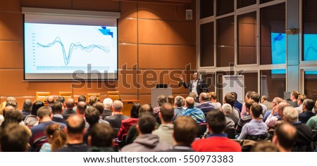Speaker giving a talk in conference hall at business event. Audience at the conference hall. Business and Entrepreneurship concept. Royalty-Free Stock Photo #550973383