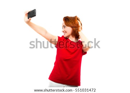 Red-haired girl holding a phone, selfie photo. The modern concept, fashion selfie photo. Trend. Isolated on white background. Selfie girl.