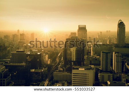 City skyline with urban skyscrapers at sunset., City during warm sunset concept