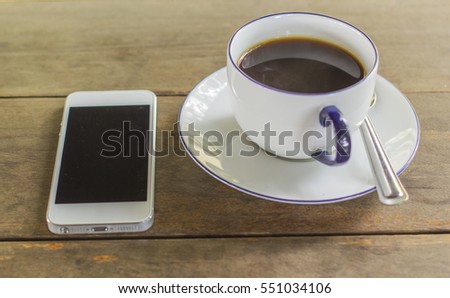 coffee,phone on wooden 