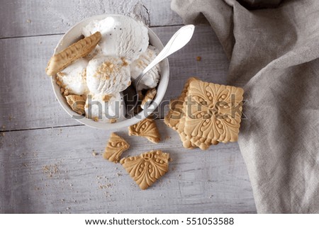 ice-cream and biscuits on wooden background. rustic style