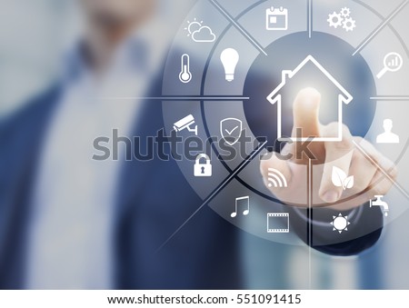 Circular futuristic interface of smart home automation assistant on a virtual screen and a user touching a button Royalty-Free Stock Photo #551091415