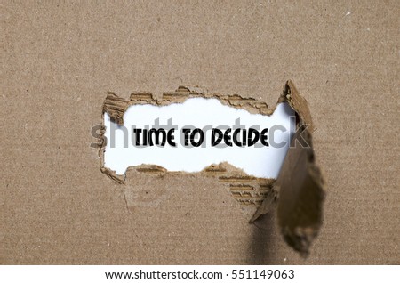 The word time to decide appearing behind torn paper
