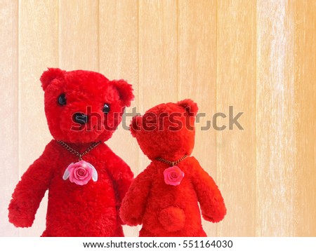 Teddy Bear red couple, and pink roses in white soft wood background. Valentines Day.