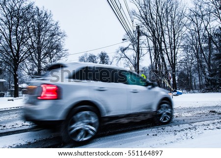 A car driving too fast on a snowy road in winter