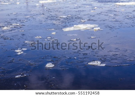 a piece of ice in the river in winter