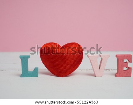  Vanlentine day concept. Wooden letters word love and red heart  on vintage wood background with copy space for create idea for valentine day.