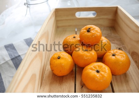 Oranges in  wooden crate.