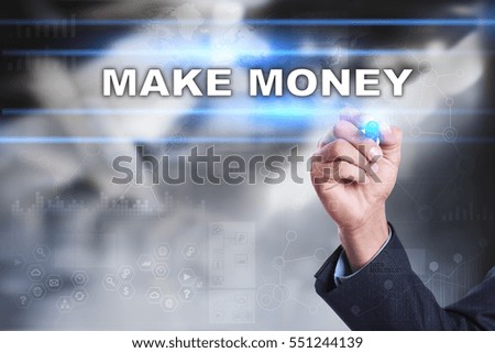 Businessman is drawing on virtual screen. make money concept.