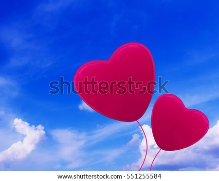 Love story and valentine day concept on blue sky background, balloon heart floating, copy space