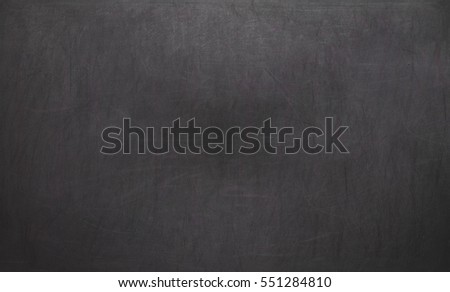 Blackboard / chalkboard texture. Empty blank black chalkboard with chalk traces