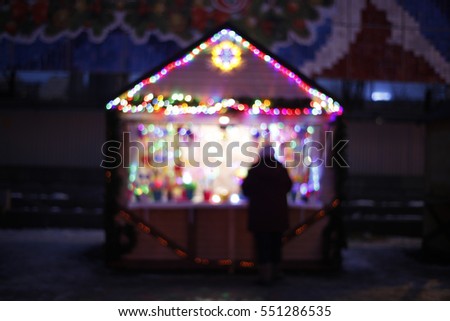 Blurred background: Christmas stall, night market with defocused lights