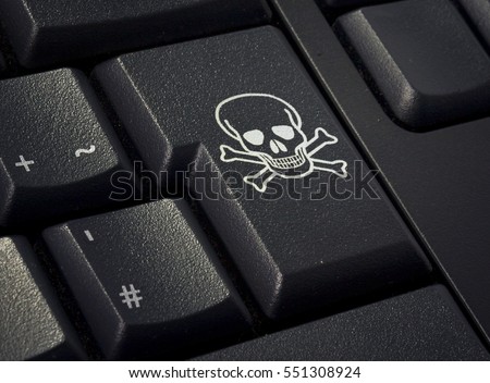 Return key of a black keyboard with the shape of a skull imprinted .(series)