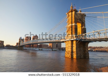 Suspension bridge in Cincinnati Ohio at sunrise.
