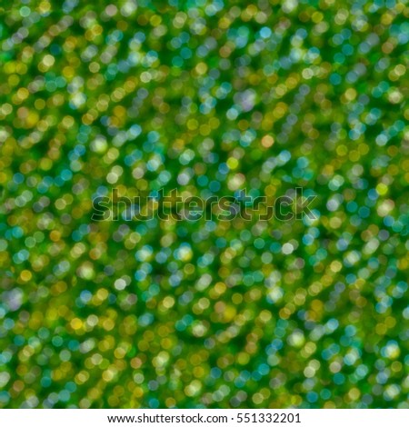 Abstract green glitter soft focus background. Seamless square texture. Tile ready.