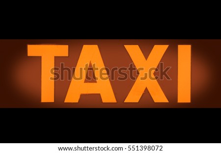 Detail Of An Orange Taxi Light Sign