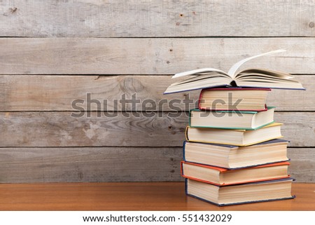 Open book on the wooden background