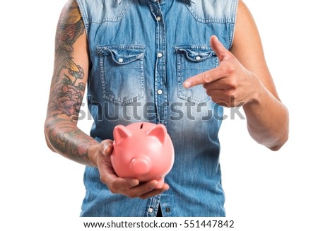 Asian handsome man holding a piggybank