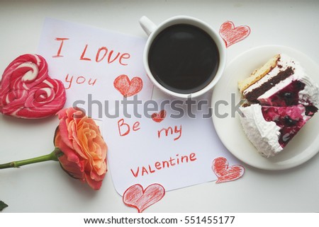Valentine background with pink rose ,coffee and a piece of cake.with word I LOVE YOU and be my Valentine.Happy lovers day.Valentine's day holiday.Valentine's day concept.Valentines day card