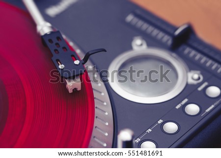 Turntables needle on vinyl disc. Turn table playing record with music. Professional dj audio equipment. Listen to the music in hi fi. Hip hop disc jockey setup. Disk jokey gear for scratching