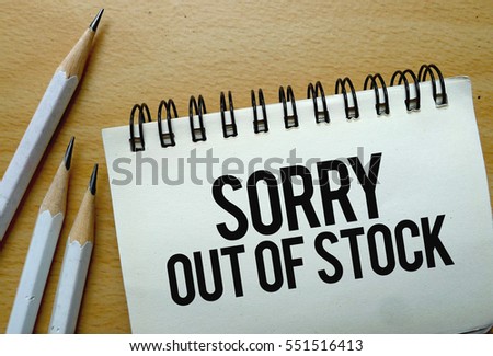 Sorry Out Of Stock text written on a notebook with pencils