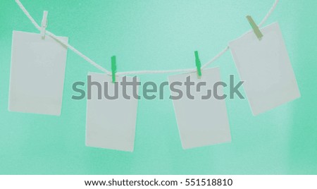 empty black photo frames hanging with abstract colorful background 