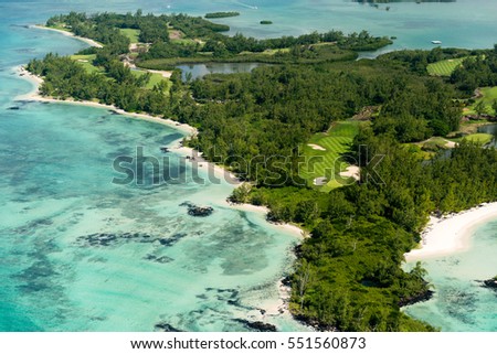 Aerial picture of Golf course surrounded by the beautiful turquoise lagoon of Mauritius